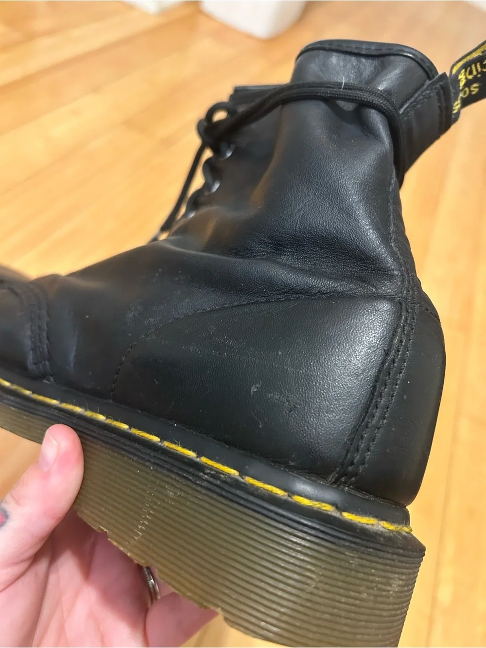 Dr. Martens Black Leather 8-Eye Lace-Up Boots with Yellow Stitching